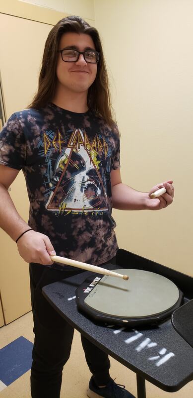 This image is Rhythm. This is Zack playing a rhythm on a drum pad. 